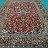 9'11" X 13'6" Iran Hand Knotted Red Blue And Golden Floral Area Rug – 9'11" × 13'6"